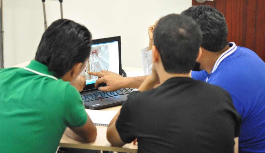 Team reviewing photographs and documentation of another team_b.JPG