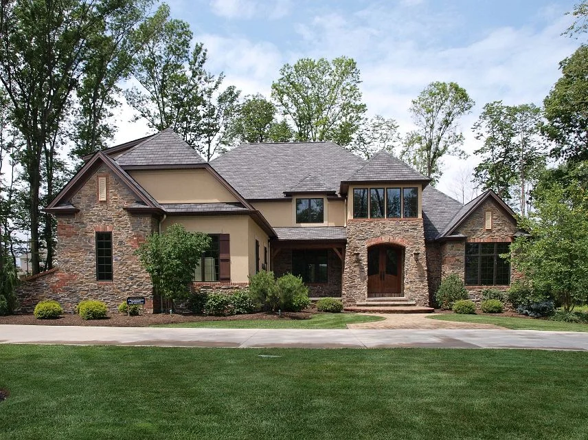 Custom home exterior with stone and stucco facade built by Perrino Builders in Northeast Ohio