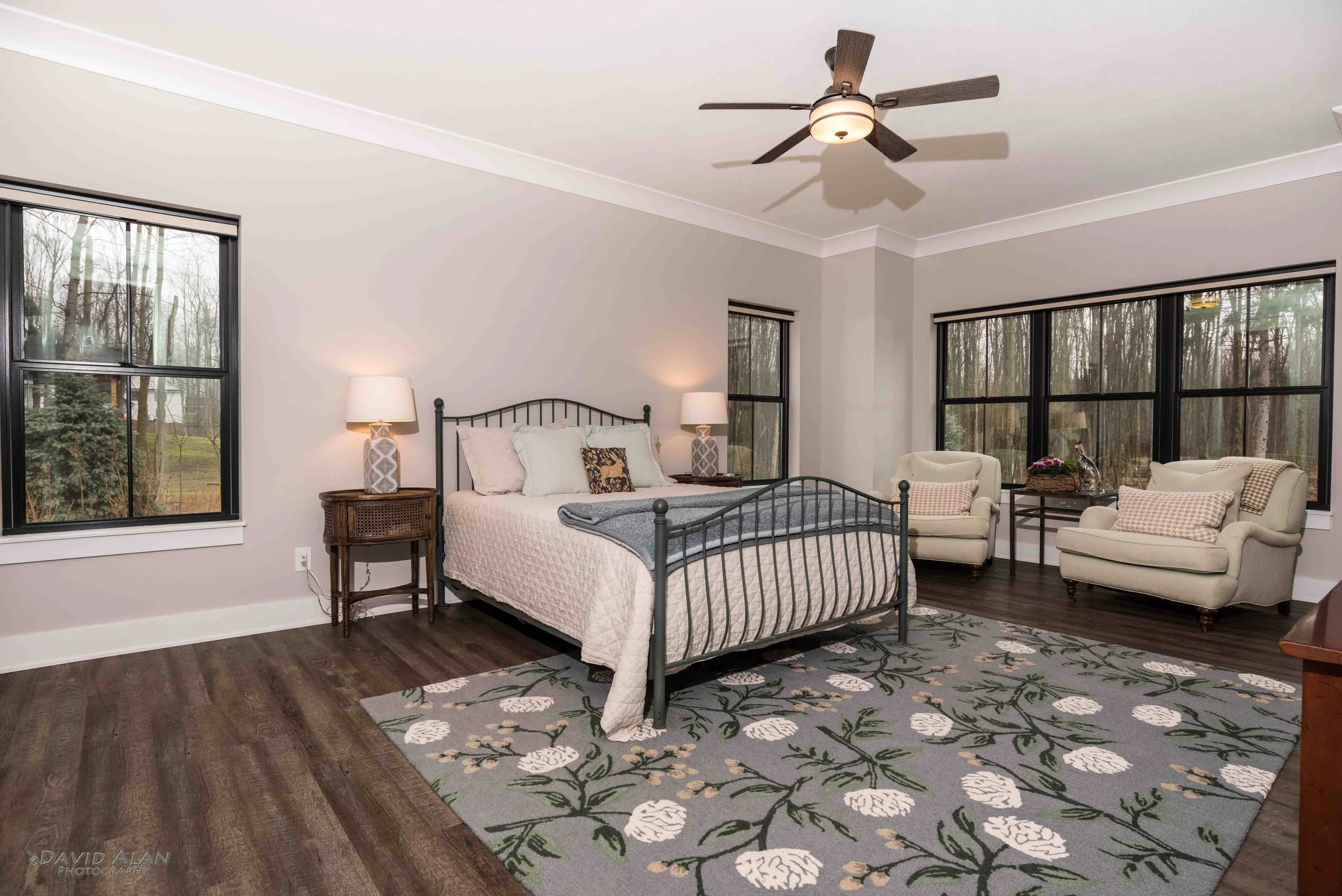 Custom home primary bedroom with large windows and natural light built by Perrino Builders in Northeast Ohio