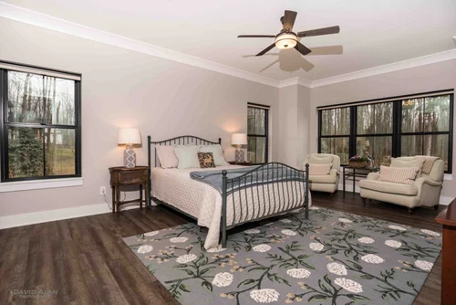 Bright primary bedroom in a Perrino custom home