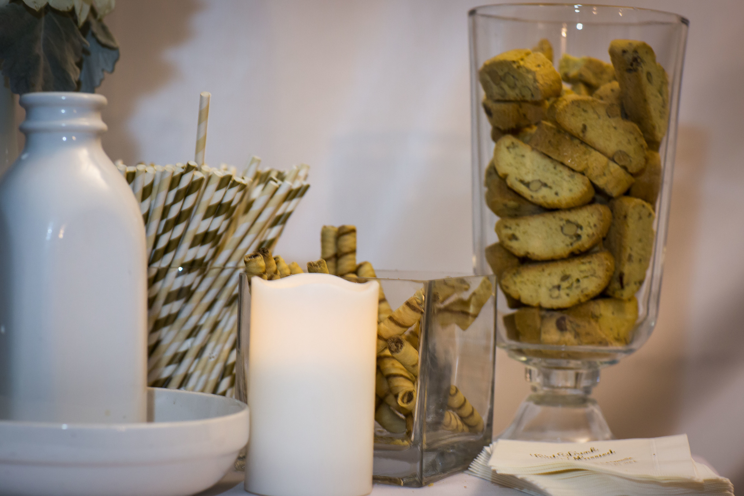 we had a coffee bar with biscottis, chocolate pirouettes, straws that match the wedding, and personalized napakins.