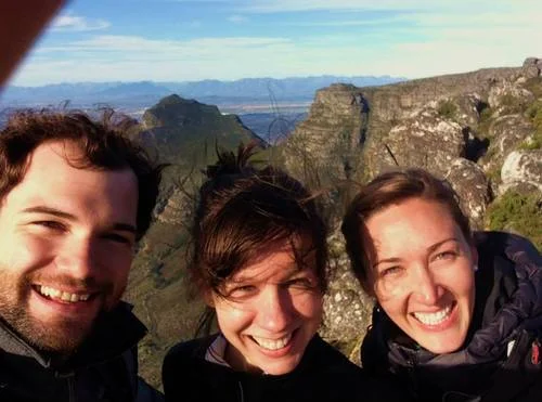 IDEV students Gregor Schueler, Lauren Fredric, and Brie Freeman who are spending the summer in South Africa, on the top of Table Mountain, Cape Town