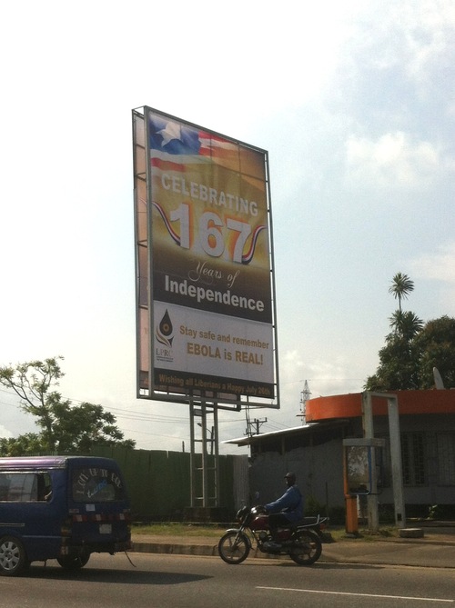 Sign marking the country’s Independence Day warns Liberians about Ebola. ( Photo credit: Jennifer Majer)