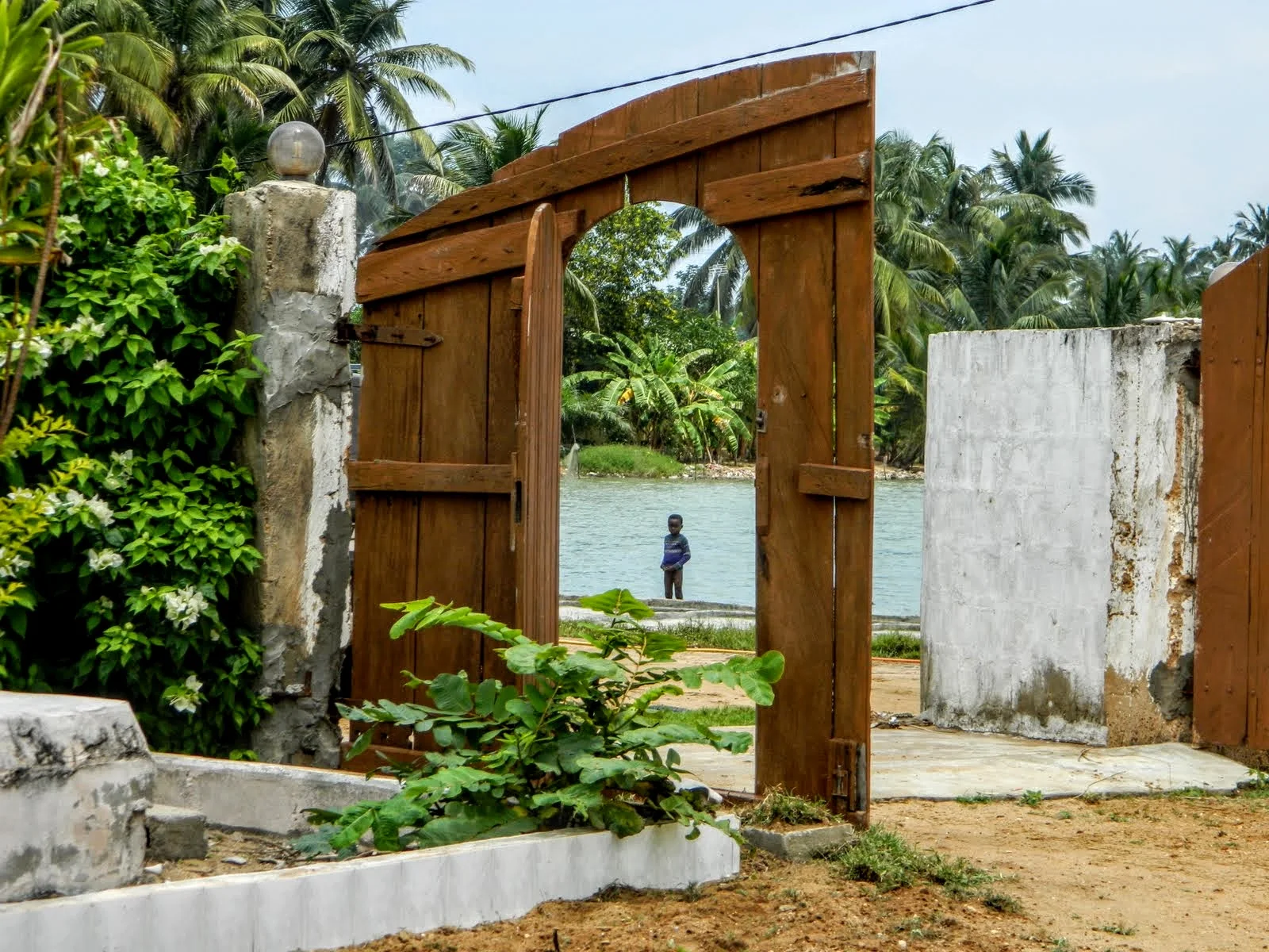 Kid in Doorway at Sweet Mother.JPG