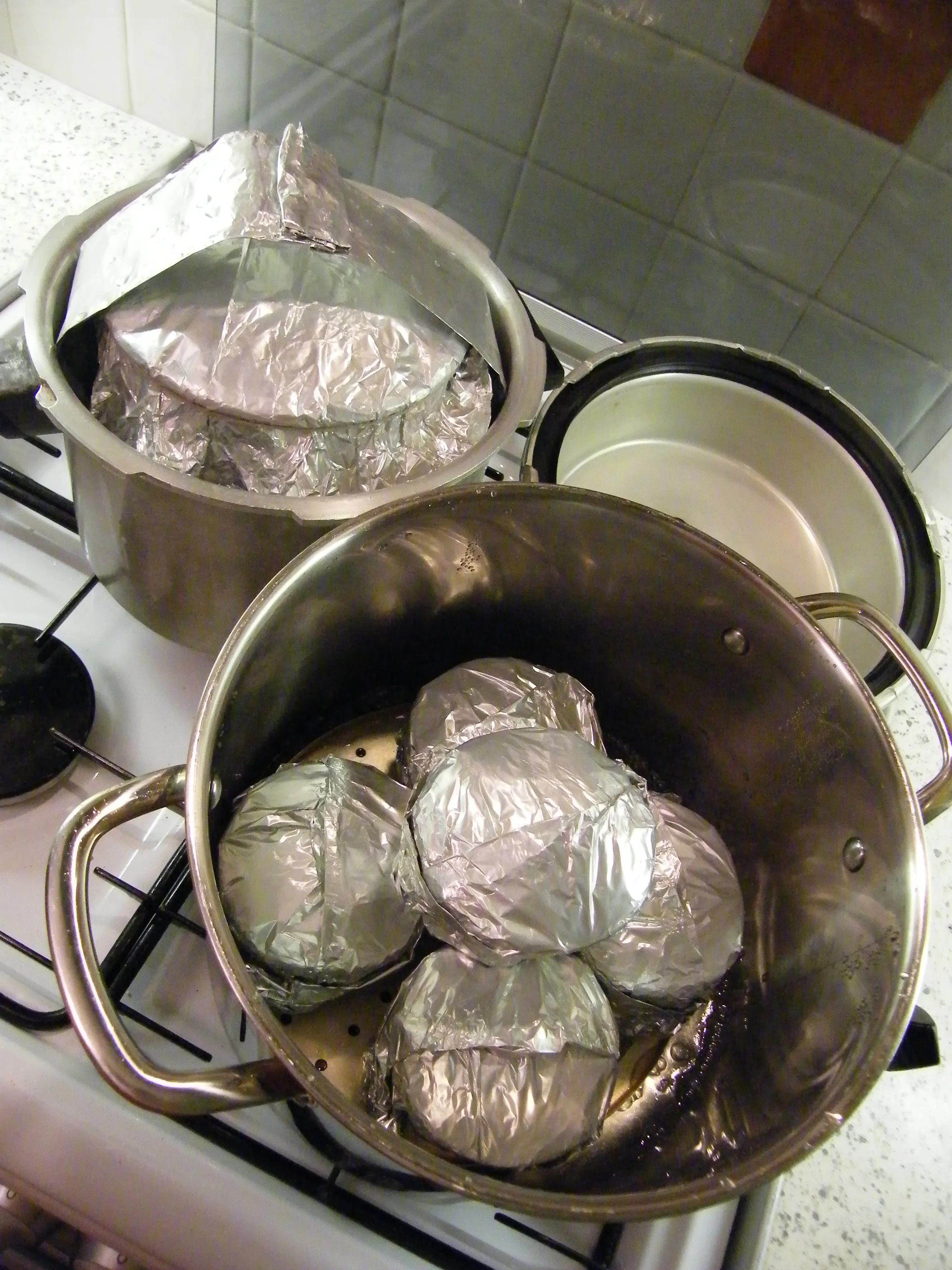 A band of folded foil helps to lift out the large, heavy, hot pud.
