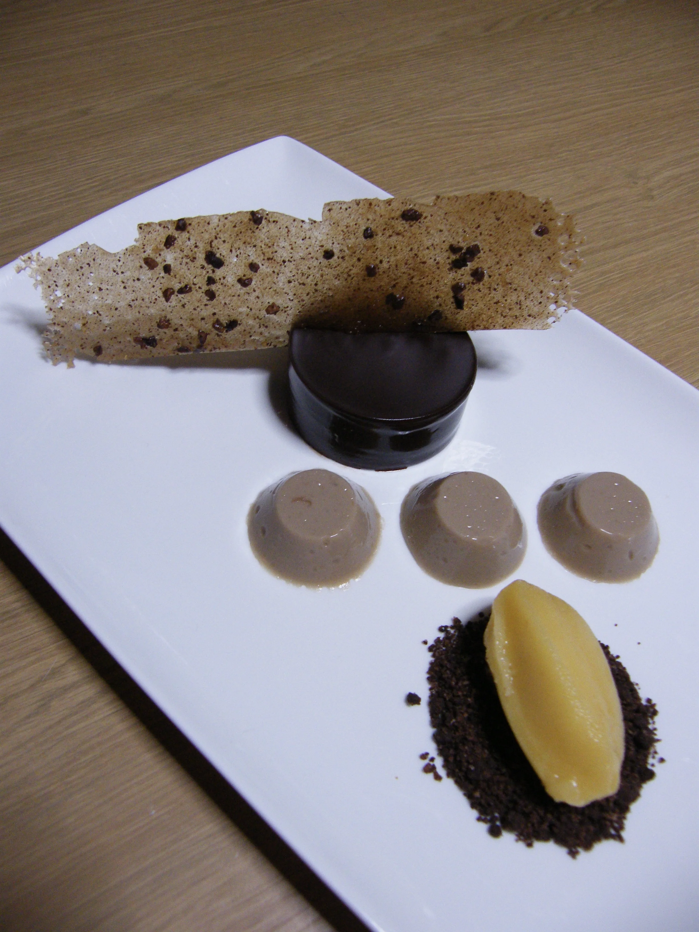 Dark chocolate ganache, banana and passion fruit sorbet and cocoa nib tuile It took eleven months... but here's my version 