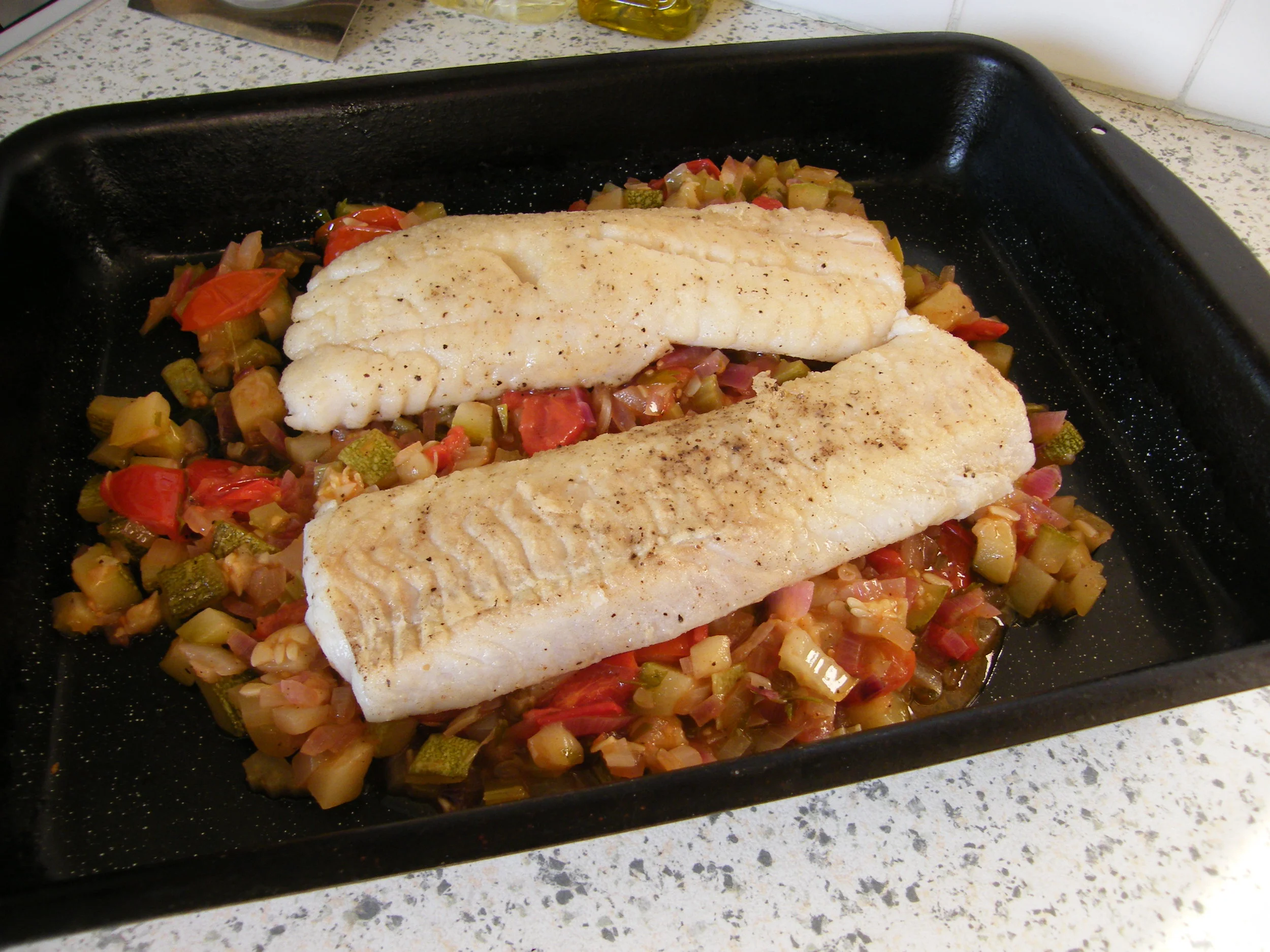 Baked haddock on courgette caponata