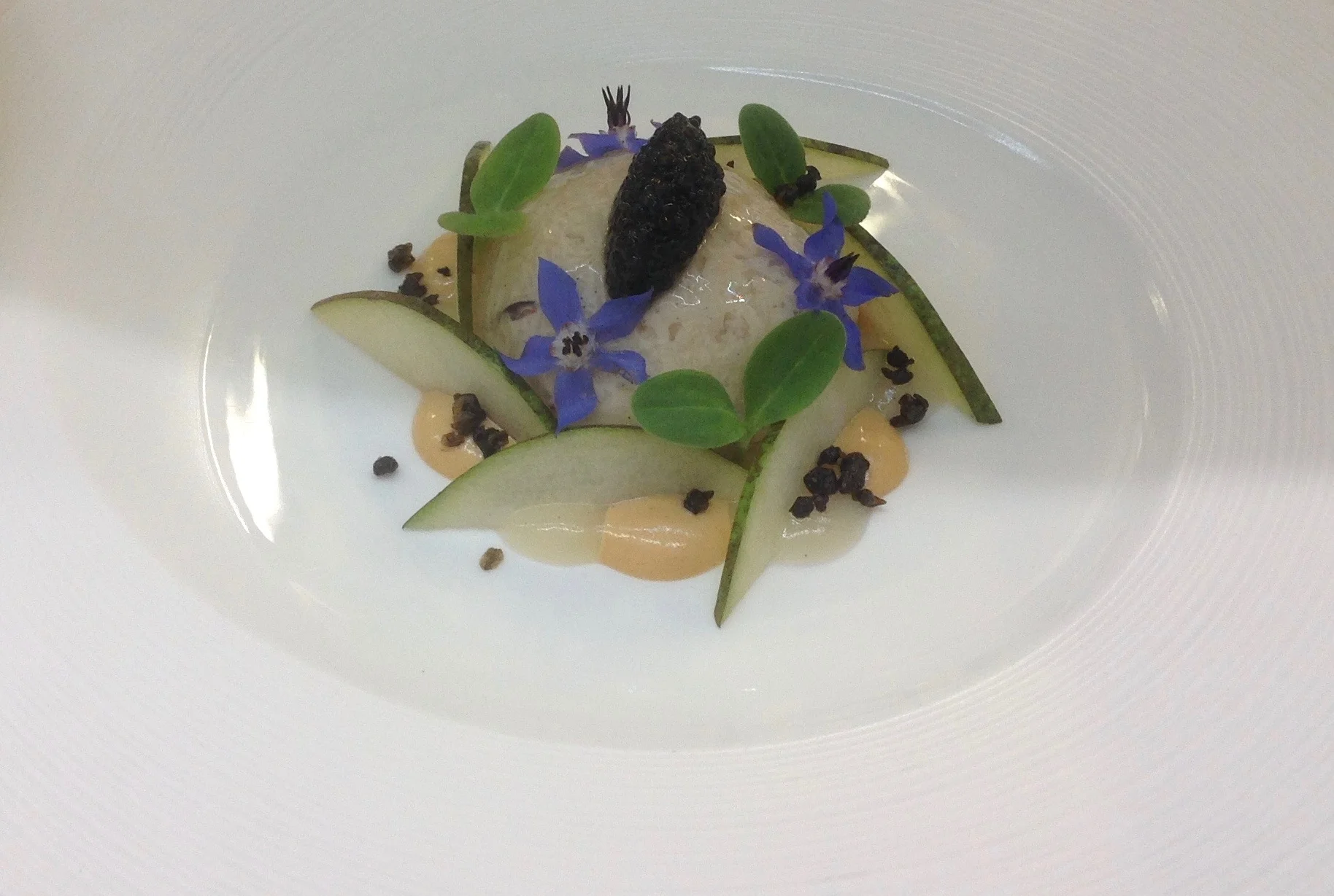 Flaked Dorset Cock Crab brown crab emulsion, fresh pear, borage flower and caviar