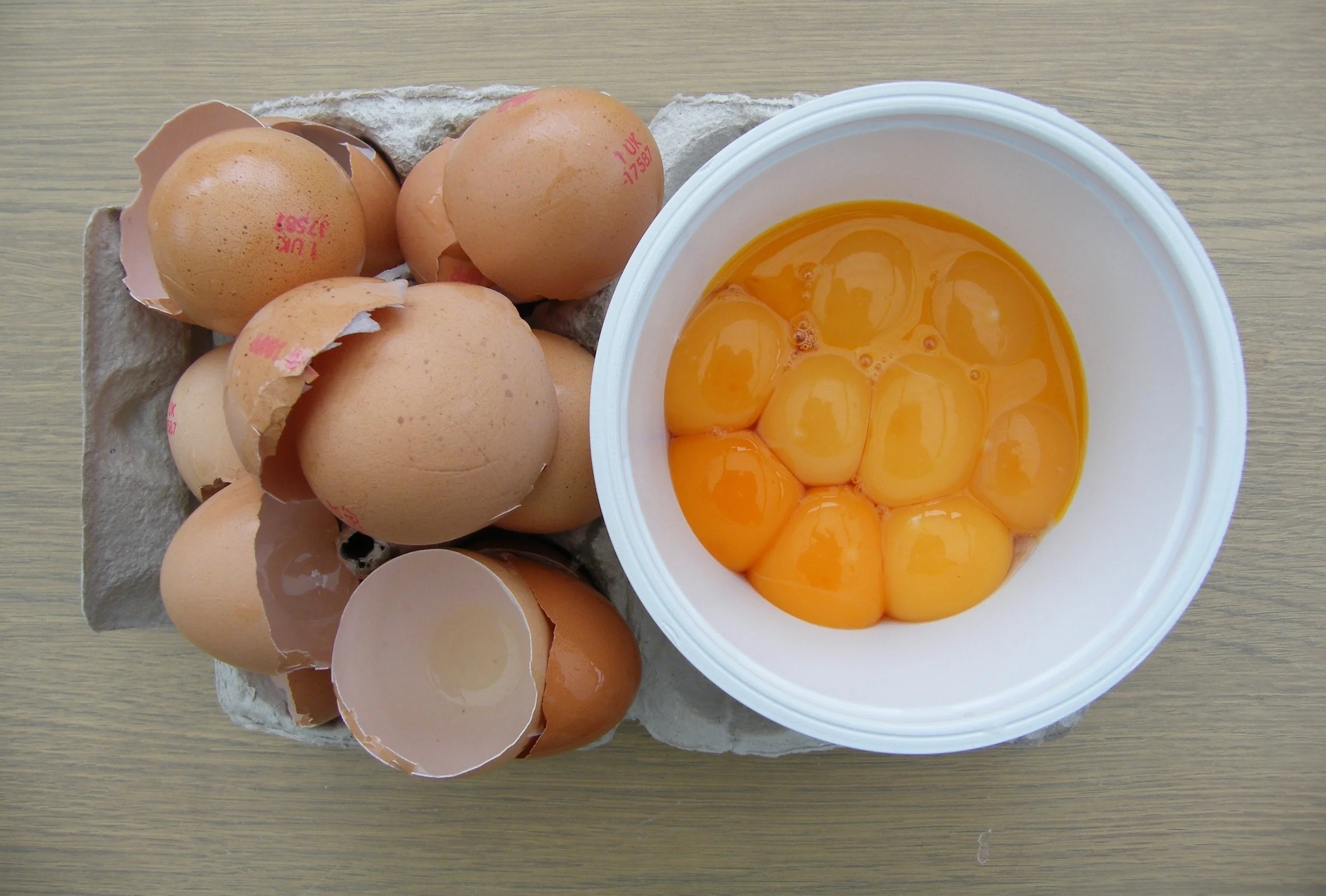 Ten yolks = 180 grams... but weigh your own and check