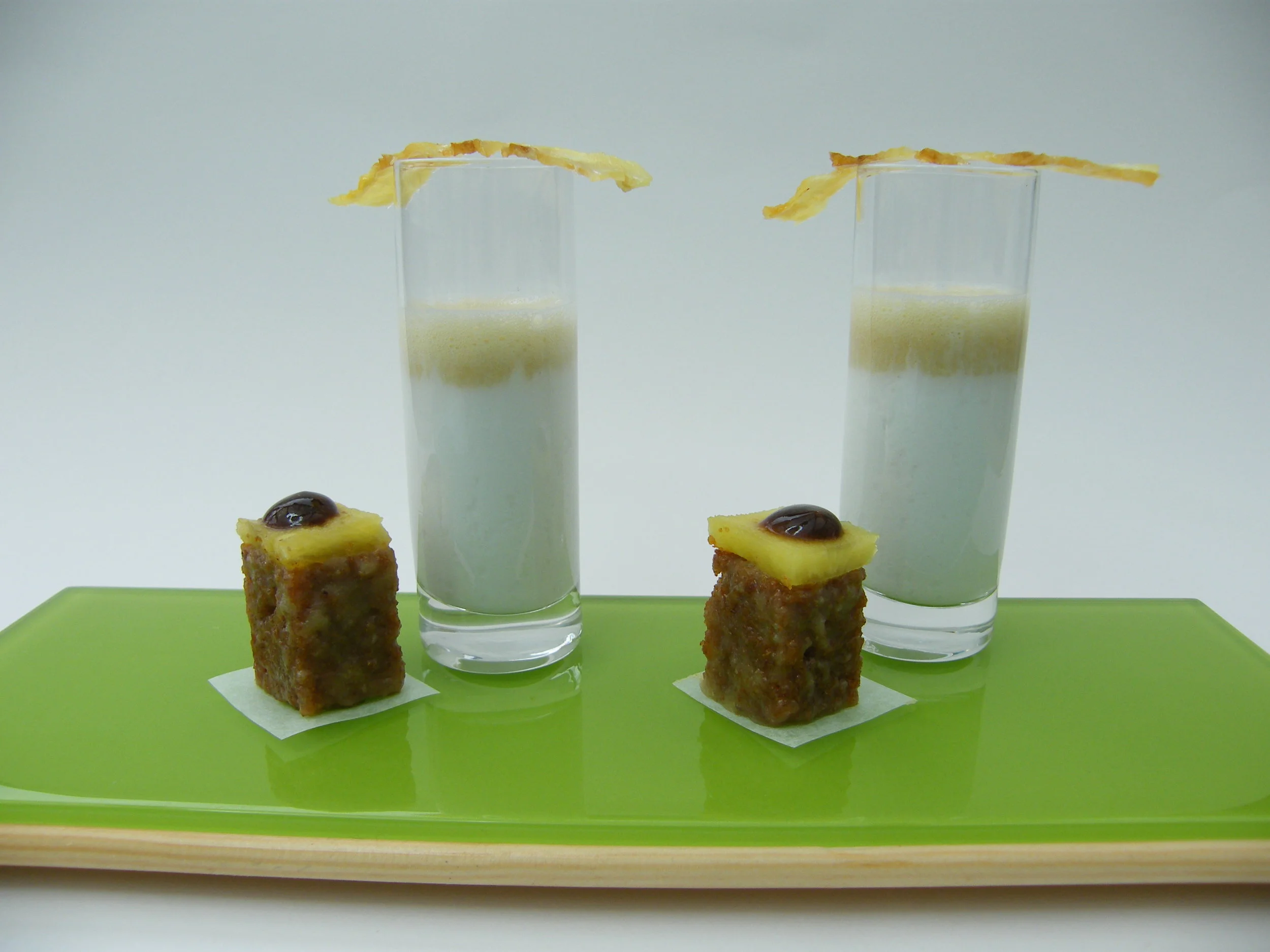 A suggestion for leftovers. Molasses gel with the pineapple/bread combo. Pineapple tuiles top a shot of 'Malibu' and pineapple foam.