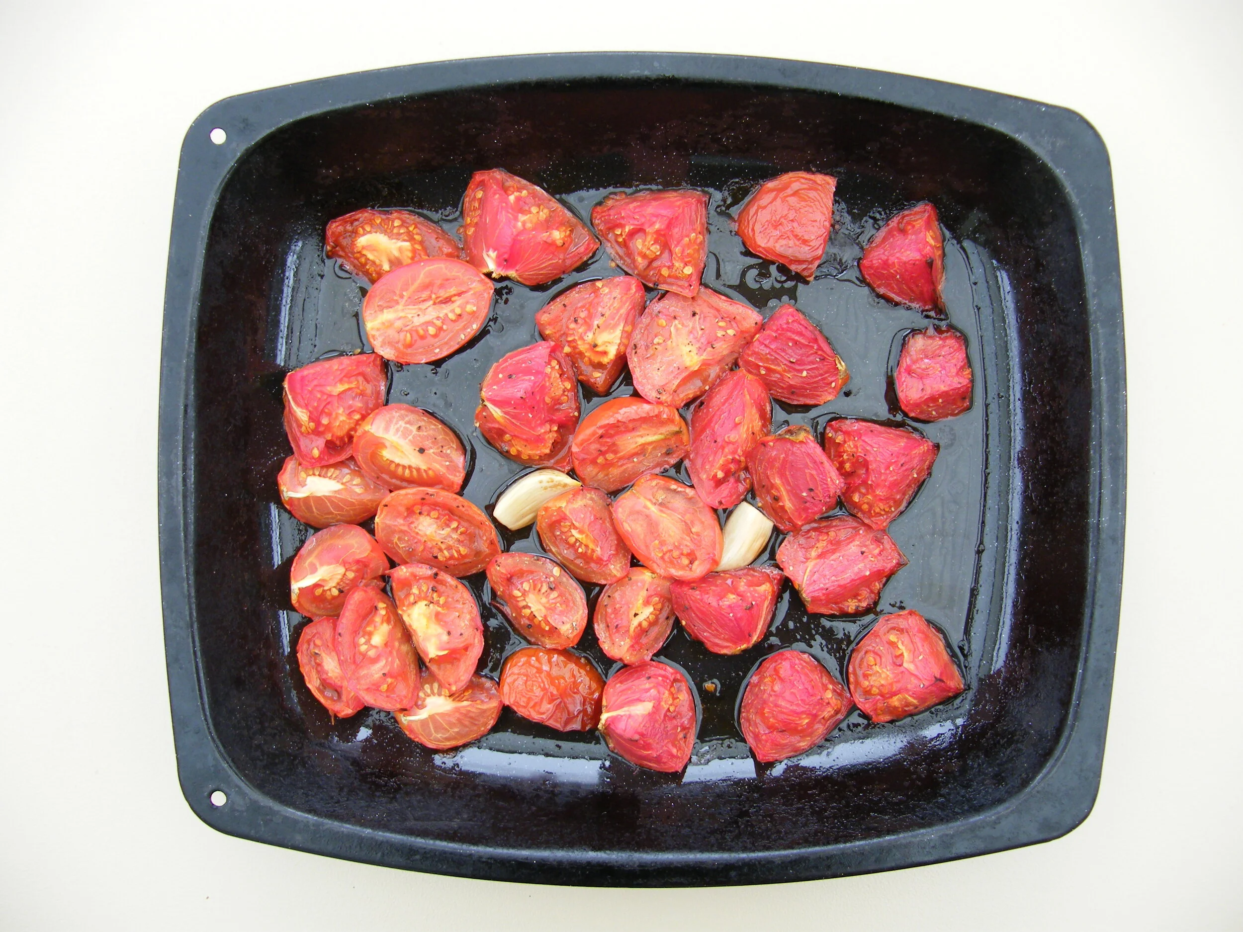 Roast 750g of roughly chopped tomatoes with two peeled garlic cloves in olive oil for 40 minutes at 180 degrees C.