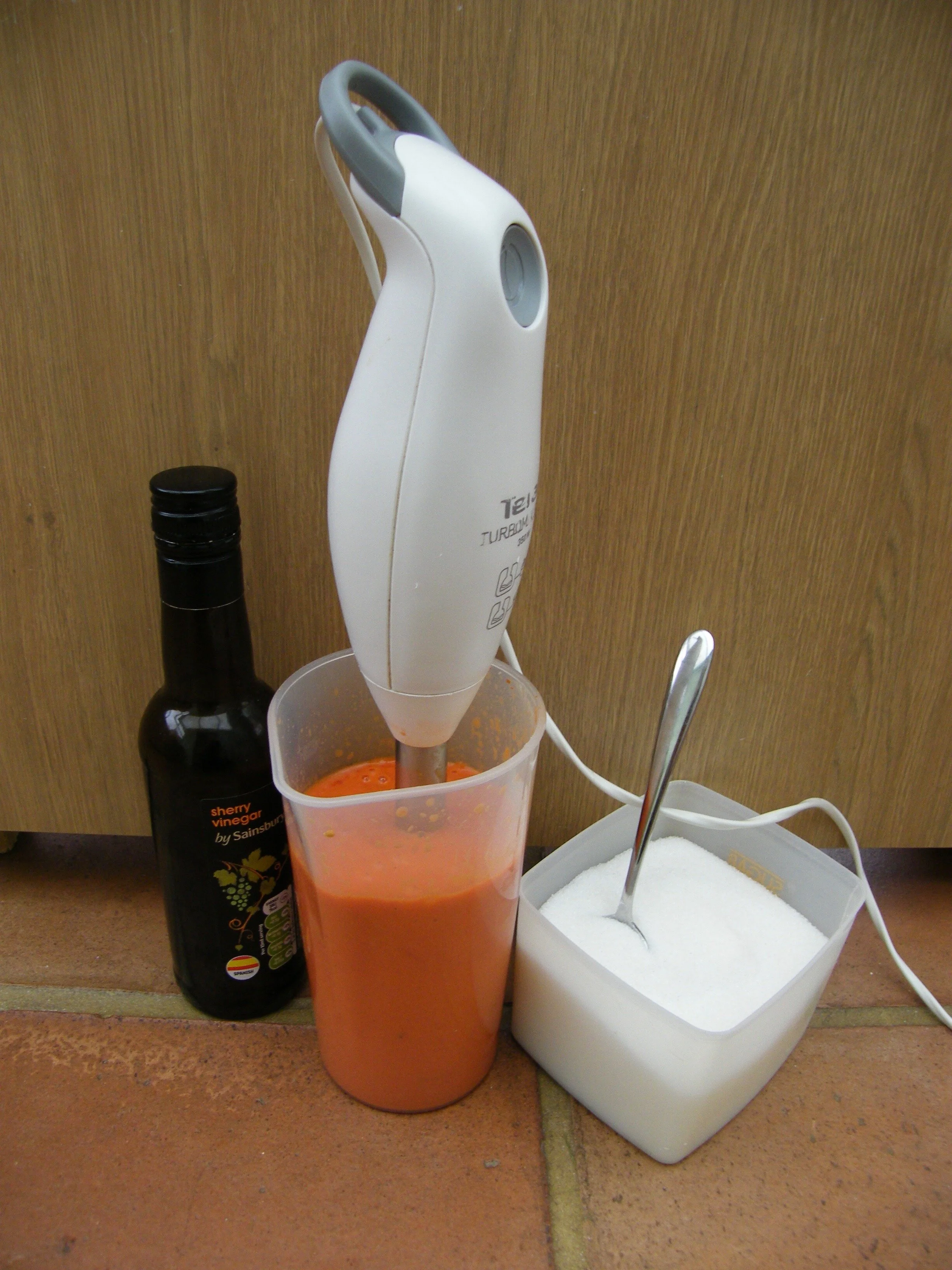 Add a tablespoon of sherry vinegar and create smoothness with a stick blender. Add sugar, salt and pepper to taste. Lemon juice will brighten things even more if you have some.