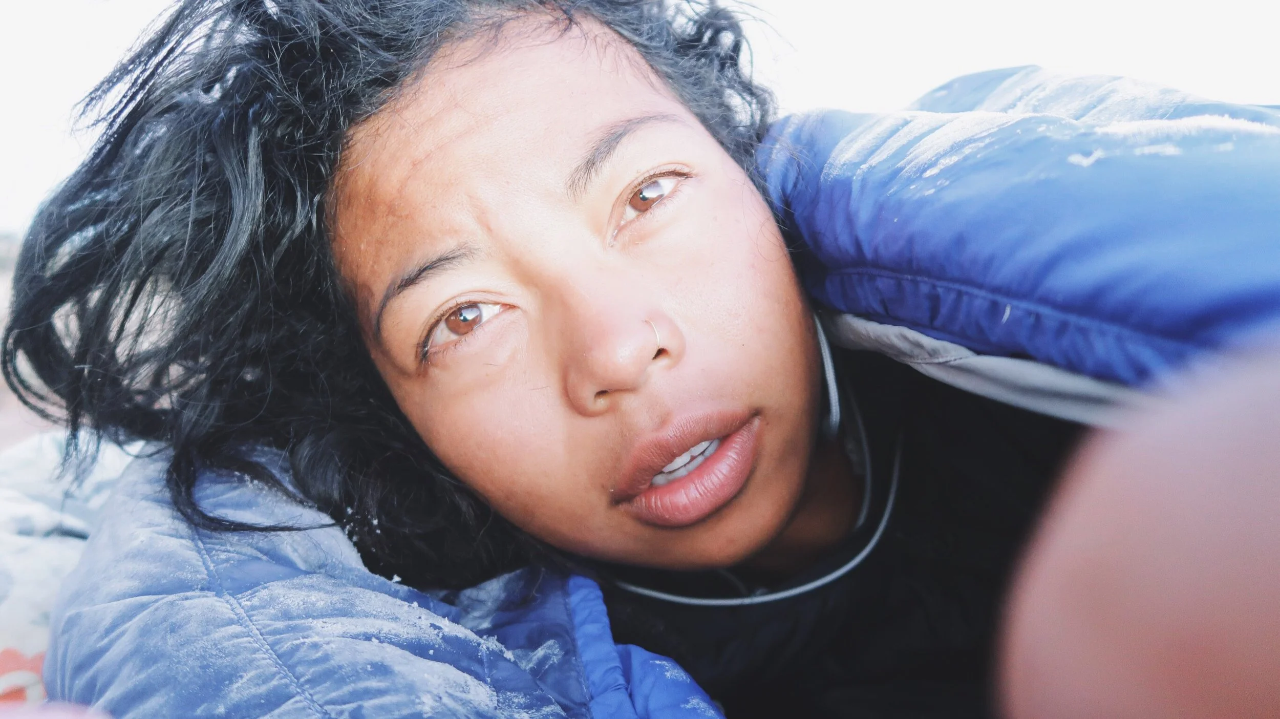 Selfie the next morning with frost on the hood of my sleeping bag.