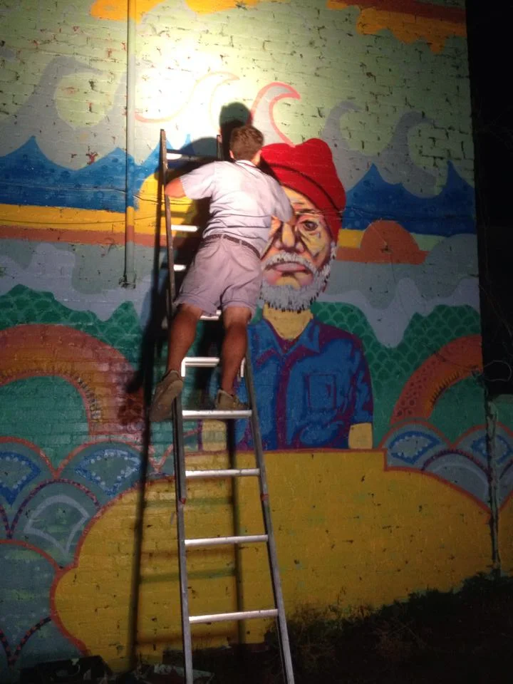Muralist, Crosby Jack, paints a live mural of Bill Murray in a submarine during the art show for Where's Murray.