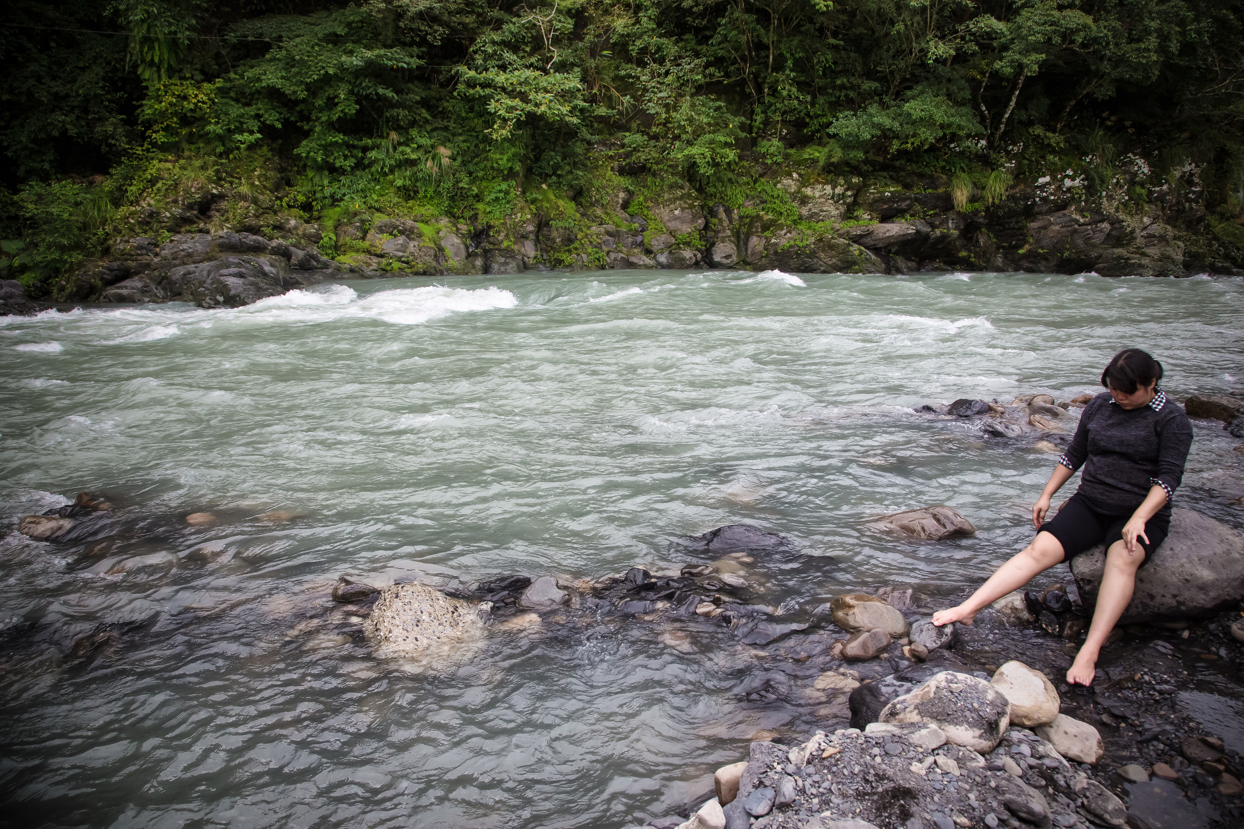 A Taiwanese woman dipping her feet in the hot spring water