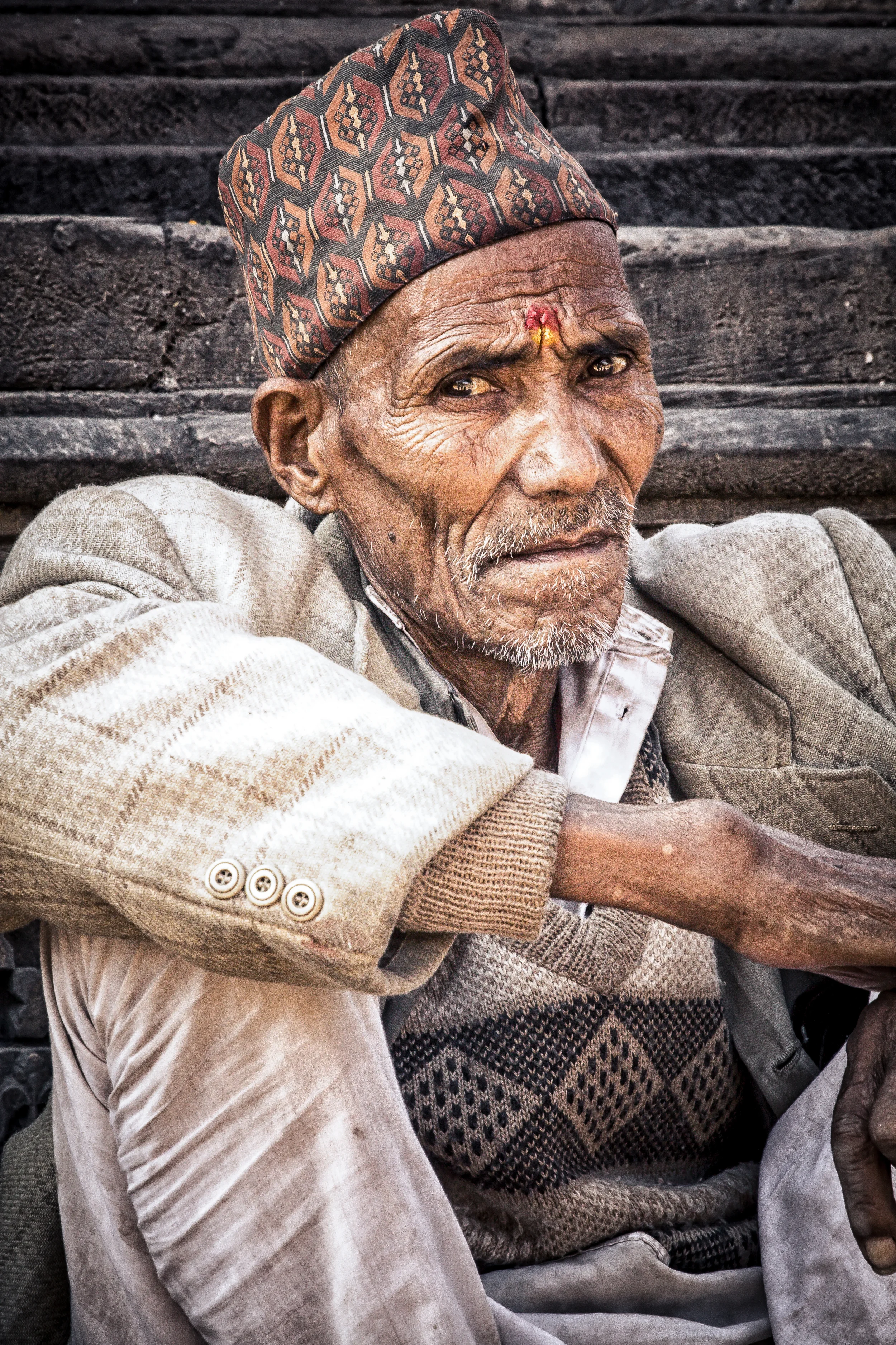 - A Nepali man taking an afternoon break in Patan Square just outside of Kathmandu, Nepal. 