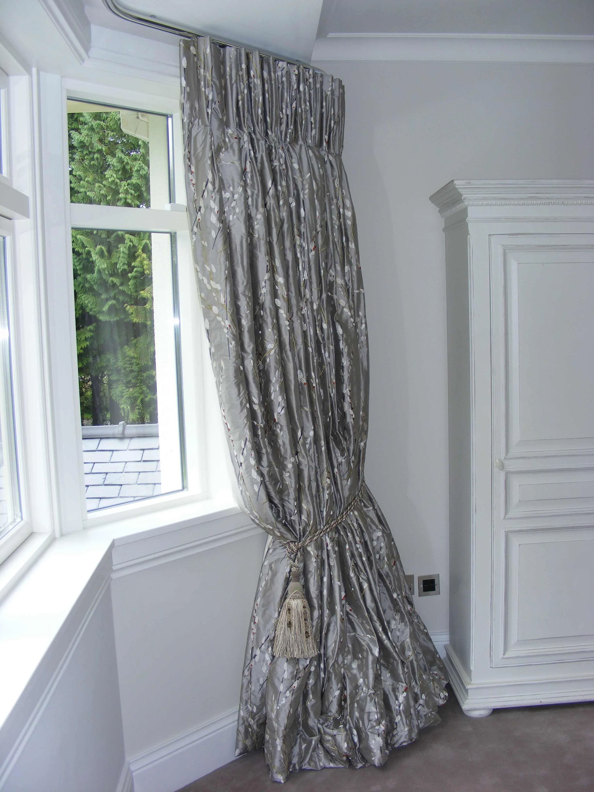 French pleated curtain hung from made to measure metal rail 