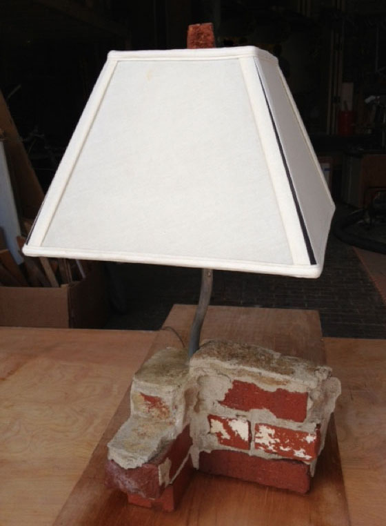Brick lamp materials salvaged from a remodel demolition silently speak to how we look at “trash.”