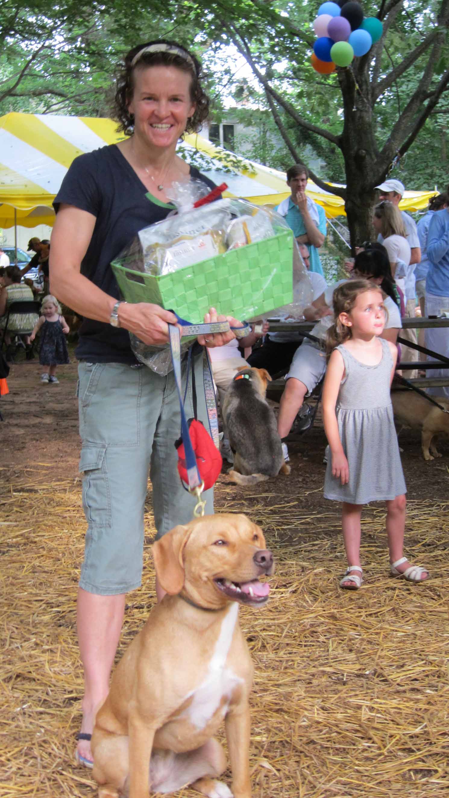 1st place winner Fenway and owner Julie Goodwin take home a prize donated by unleashed by petco.