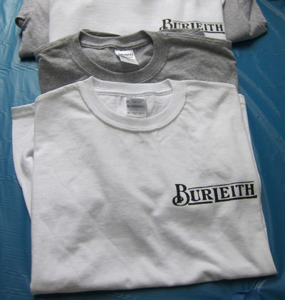 The front sports the logo used in developer Shannon & Luchs's marketing efforts in the 1920s. The back features a detail of a 1954 map of burleith and its environs drawn by Edgar F. Russell, the grandfather of longtime resident Edgar Farr Russell III.