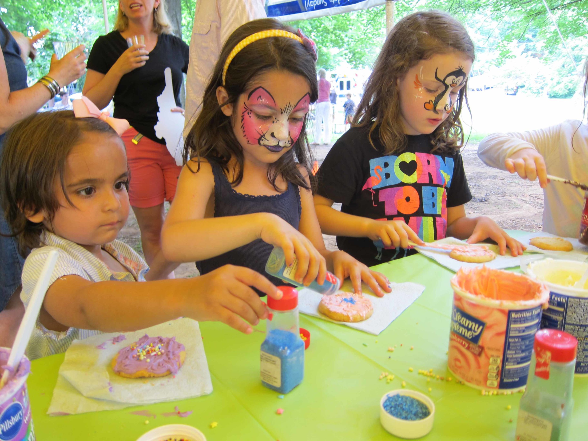 girls try their hand at gu's cookie decorating table After a stint with face painter trishla maru. 