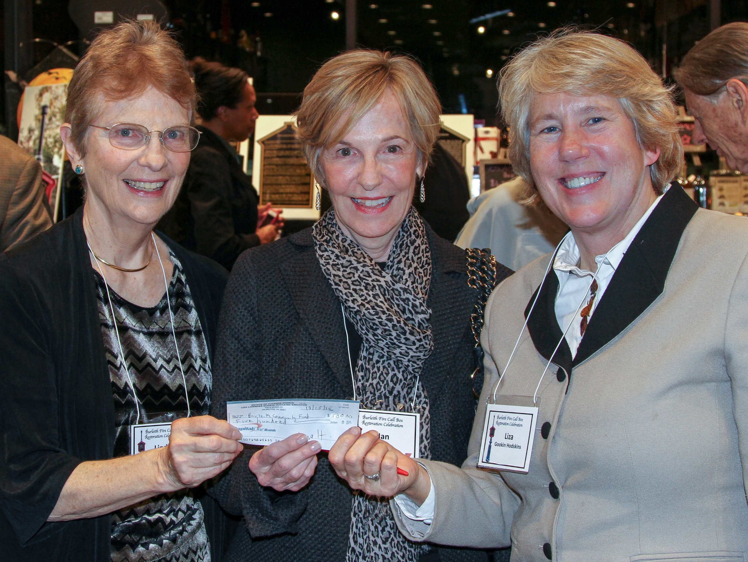 Liza gookin hodskins (right) presents the last of the needed restoration funds to Linda brooks and nan bell in honor of her parents. photo by alex frederick.