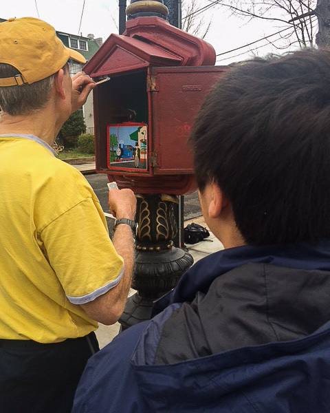 Max takes one last look at his childhood lunchbox as Ross Schipper prepares to seal up the call box.
