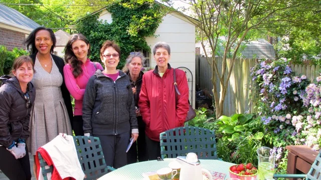 Garden club members met on a chilly May morning to enjoy hot chai and admire Carol Baume's charming garden filled with exotic plants.