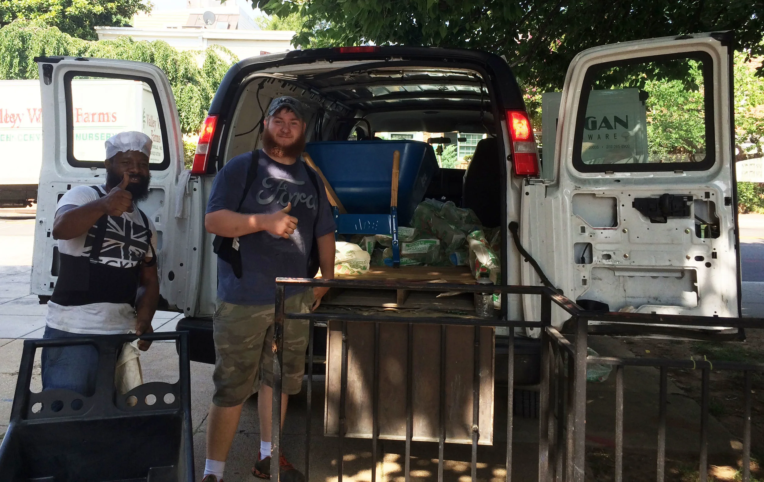 Glover Park Ace Hardware employees call it a day after delivering three tons of sand. Photos by Kevin Feder.