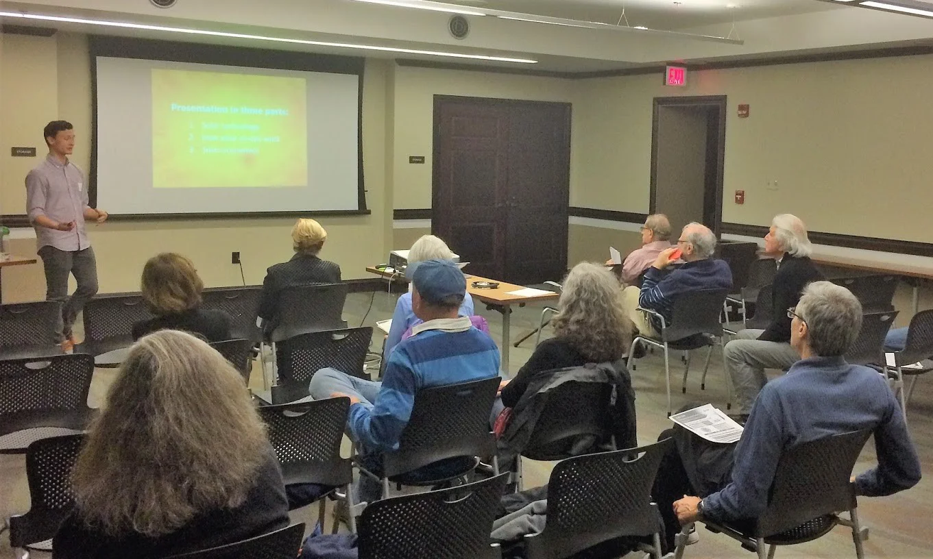 Sam Polino of DC SUN introduces the co-op to community members attending the March 28 session.