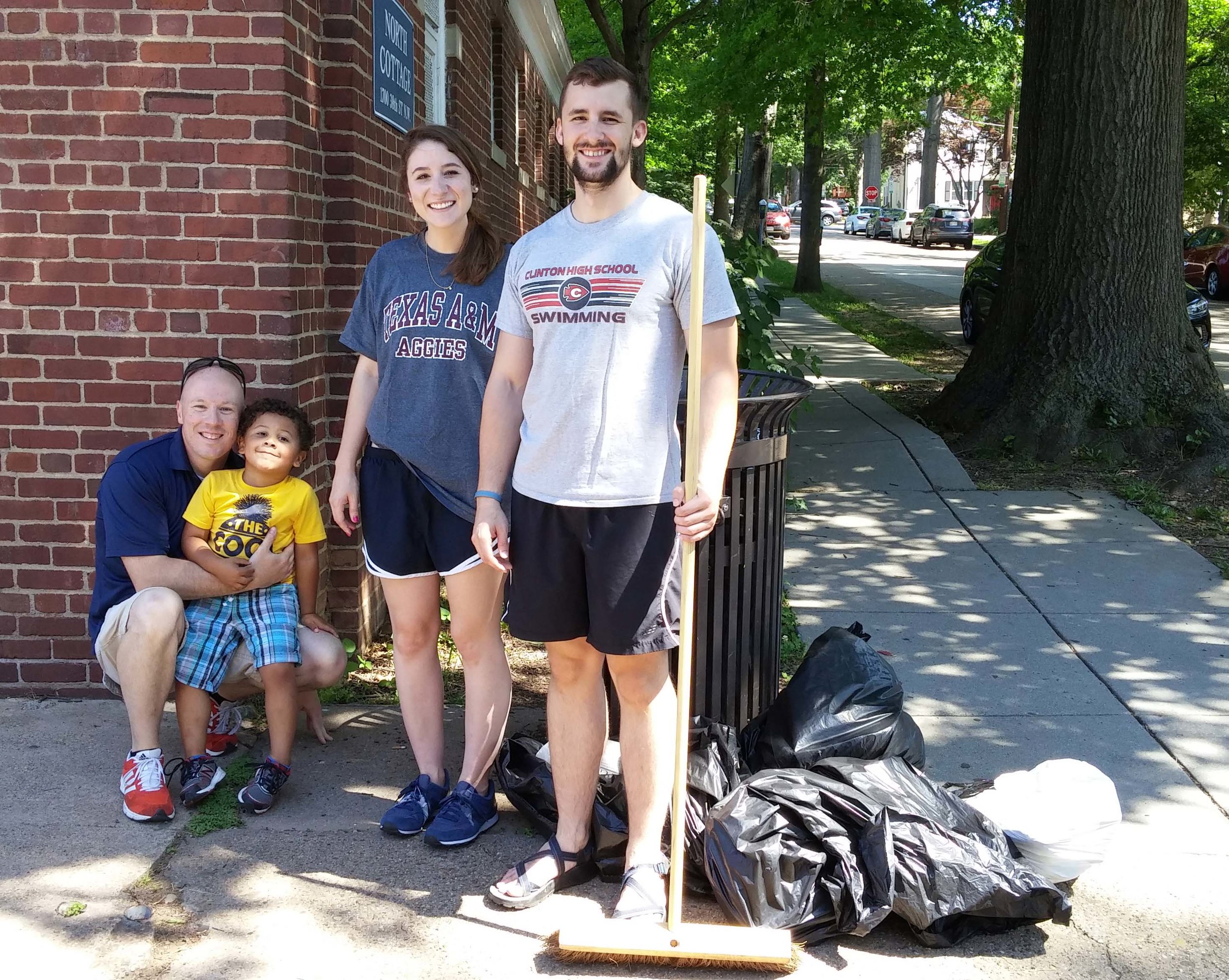 Cory Peterson (far left), director of GU's Office of Neighborhood life, and ONL program director Cat Finnegan (2nd from right) are joined by cory's son and an out-of-town volunteer.