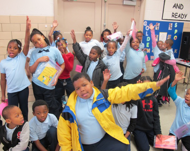 Garfield students give their tutors an enthusiastic welcome.