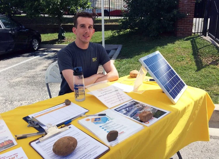 Co-op organizer Greg Miller shared info about the Georgetown-Burleith solar co-op at the farmers market last summer.