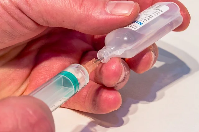Filling a syringe with saline -- salt water compatible with blood. Pic by Myriams-Fotos .