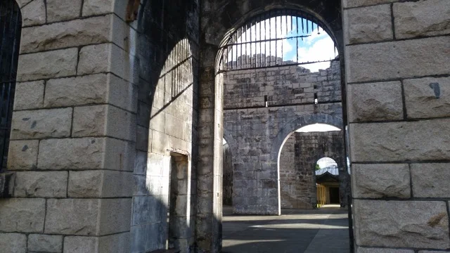Blue sky through the roof of the prison. Author photo.