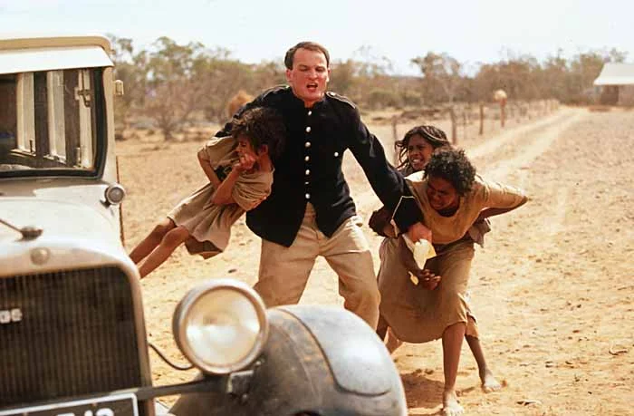 Aboriginal children snatched from their mother. Still from the movie Rabbit Proof Fence .