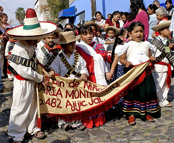 Children marching on Revolution Day in Mexico. Photo by Ute Hagan .