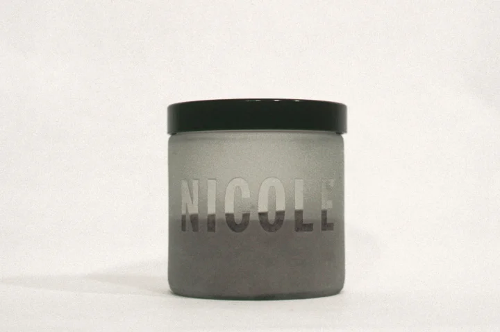 "Autobiographical Storms, Nicole" 1998, sealed glass container, locational sample of sand and ocean water