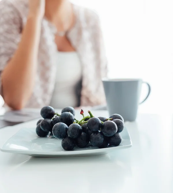 Woman with grapes.jpg