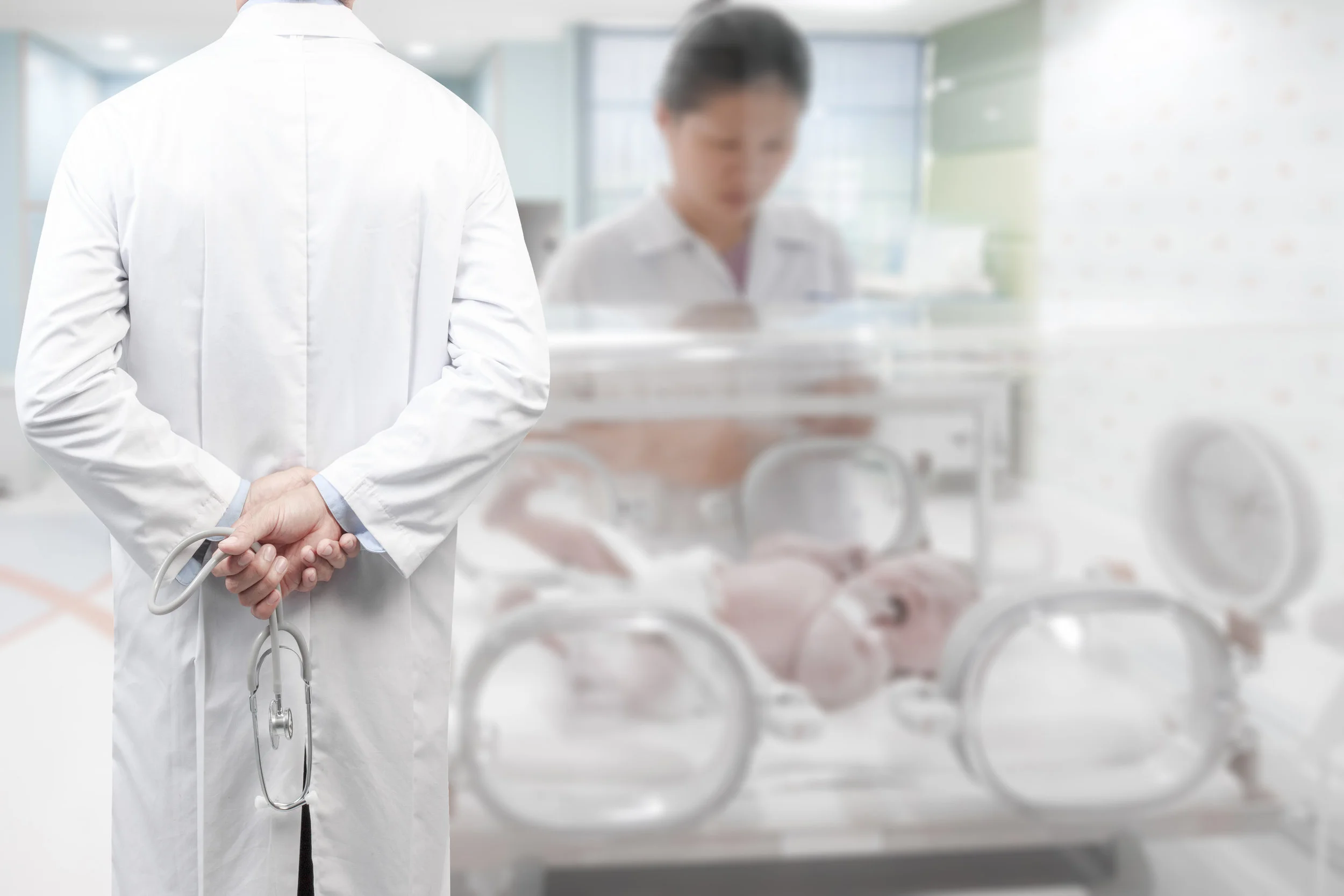 NICU doctor NICU nurse baby in isolette