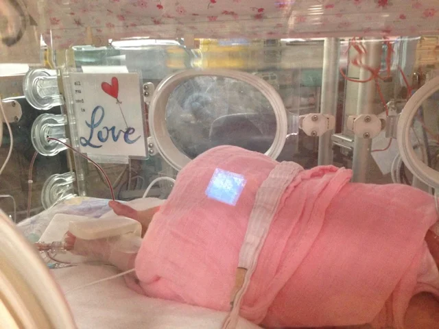 Bright colors and art in nicu isolette