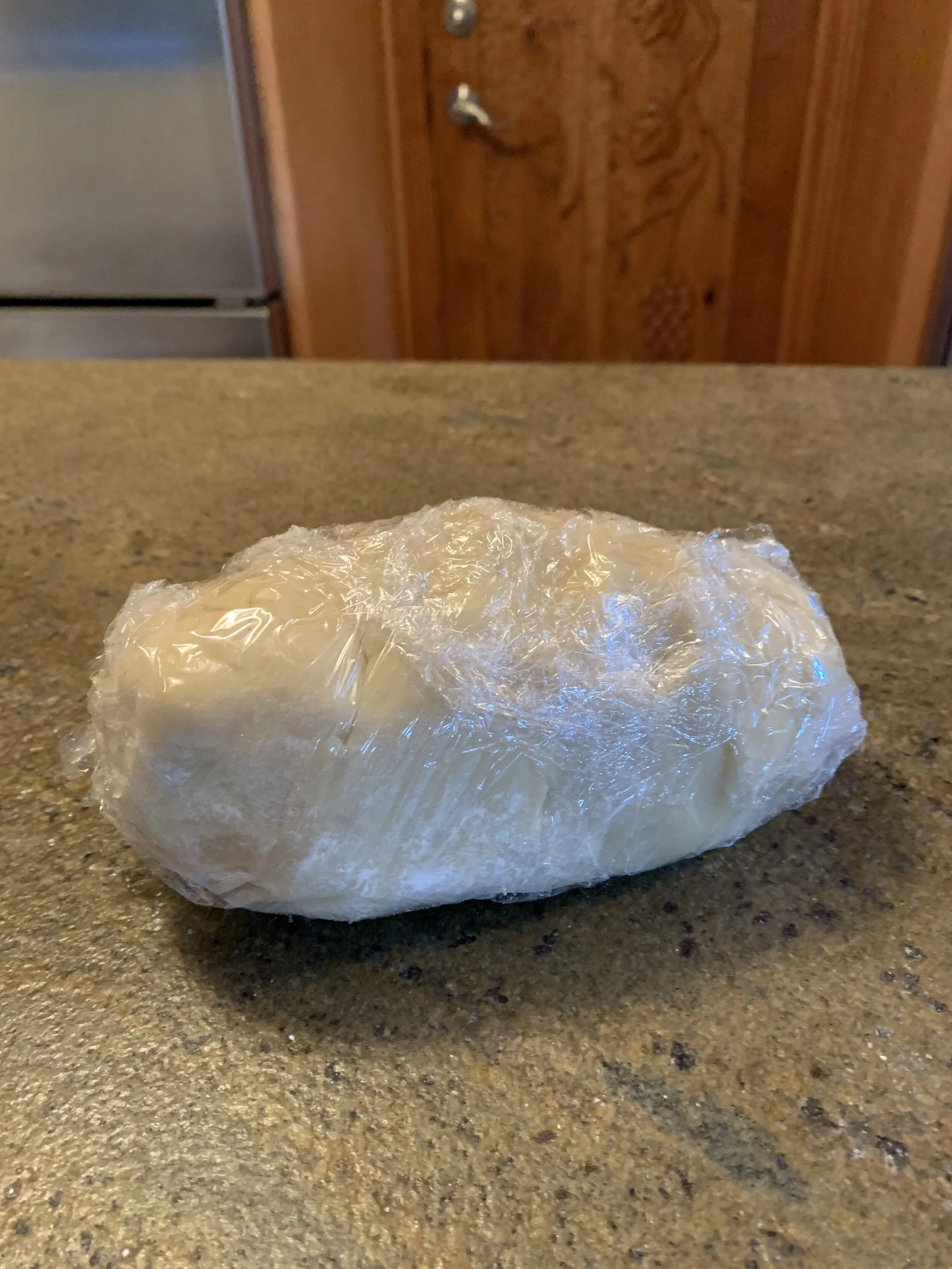 Plastic wrapped Pie Dough to refridgerate.JPG