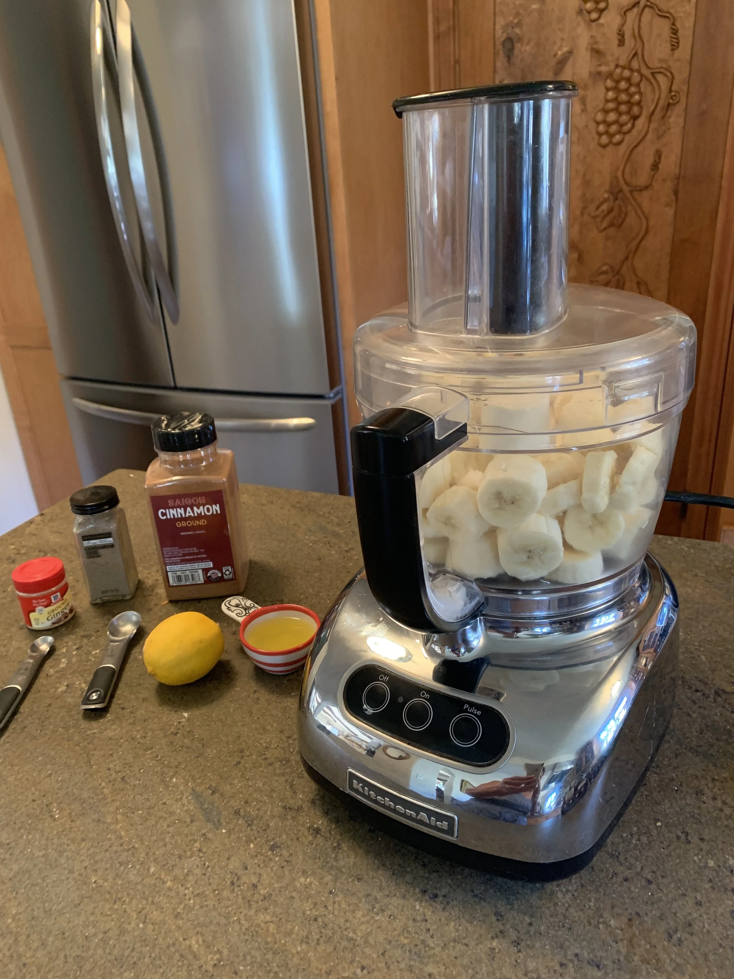Sliced frozen bananas in food processor .JPG