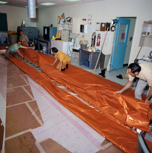 Skylab 2 parasol with humans for scale
