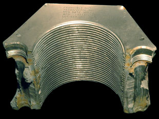 Half an SRB frangible nut, with threads clearly visible.