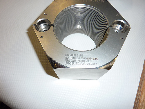 A version of the SRB frangible nut with rounded-over corners. This model was never used on a launch.