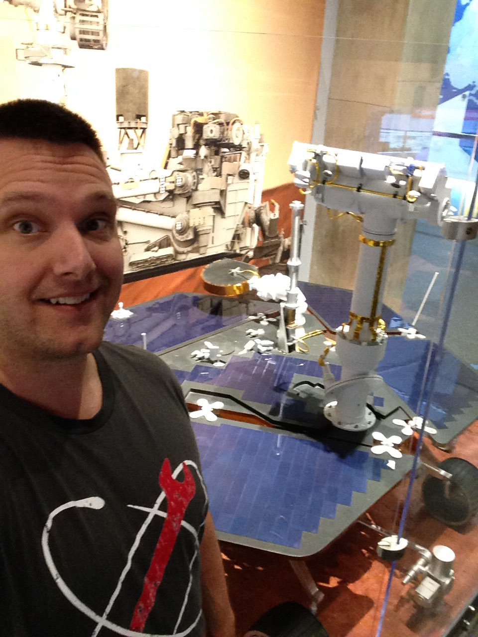 /u/Mr_Monkeypants wearing our shirt, posing in front of an MER model