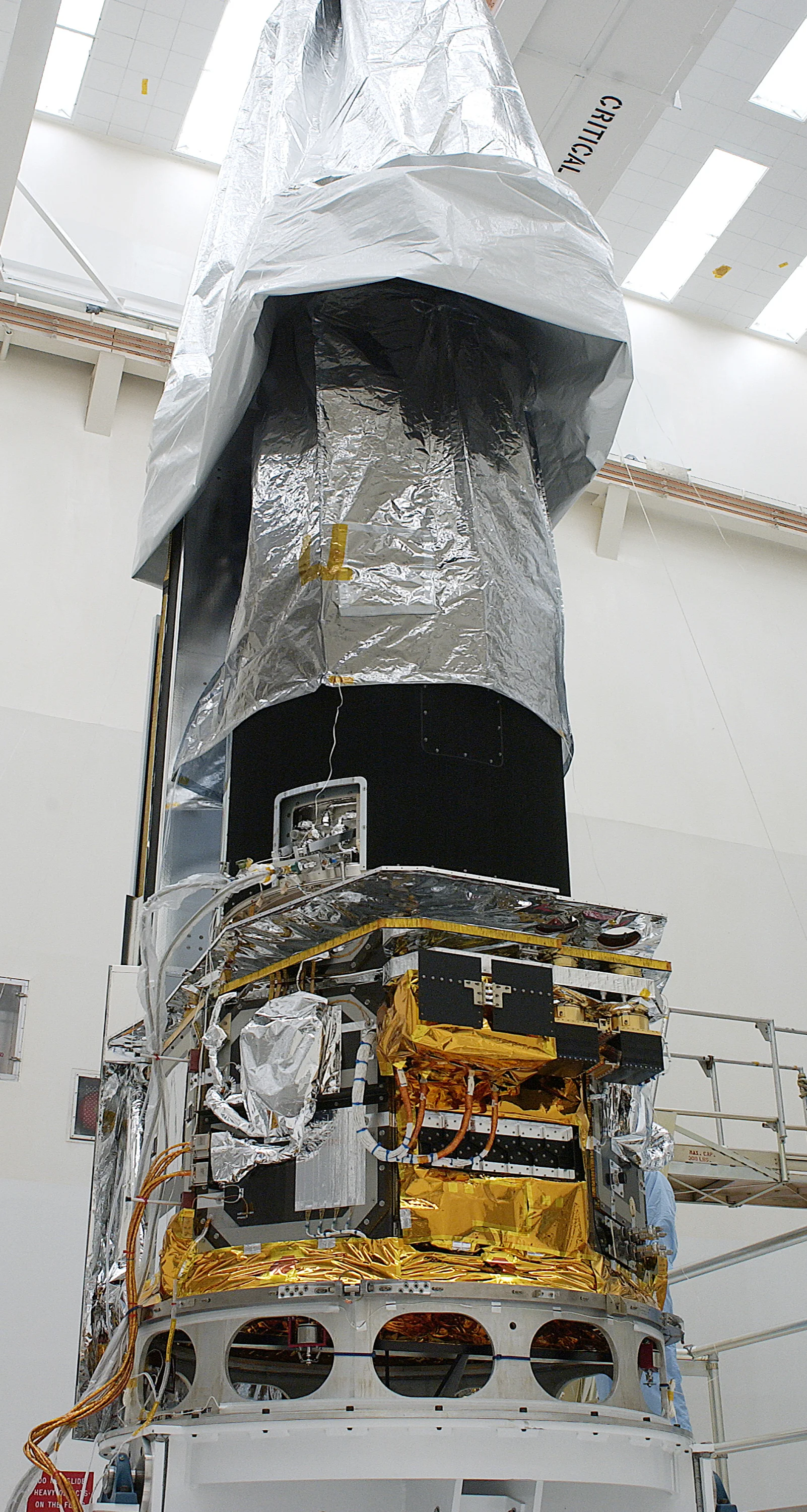 Spitzer and its dust cover