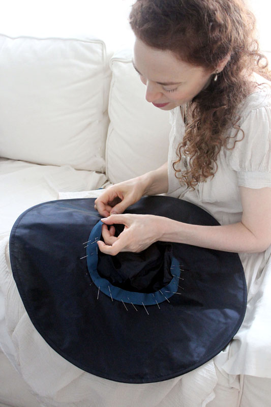 Stiching interior ribbon to a silk hat