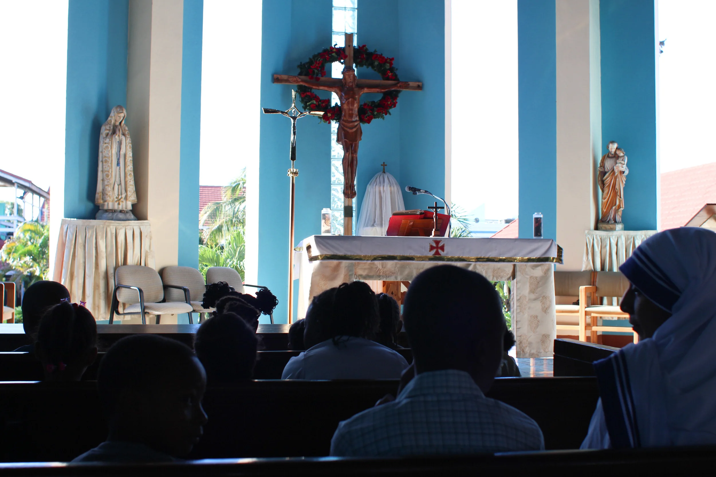 The chapel at Corpus Christi monastery has big open air windows that let in tons of light. Sunday mass there was incredibly joyful. Note the Missionaries of Charity sister (Mother Theresa's order) two rows up.